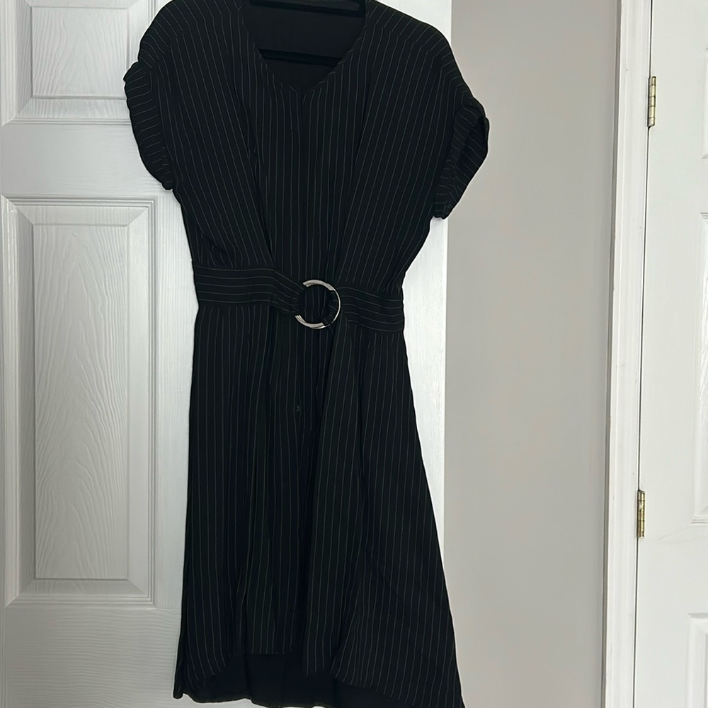 Black pin strip short sleeve dress with a silver belt